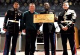The United States Marine Corps accepted a $5,000 check from the Tachi Palace Hotel and Casino from its November breakfast for Toys for Tots.